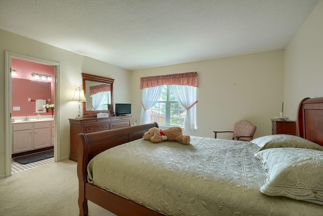 6922 Greensview Village Dr, Canal Winchester, OH 43110 - bedroom featuring light colored carpet, connected bathroom, and a sink