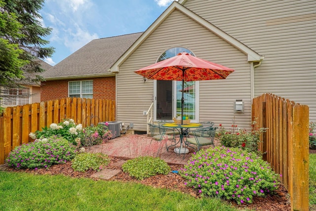 6922 Greensview Village Dr, Canal Winchester, OH 43110 - back of house featuring cooling unit, a patio, and a shingled roof