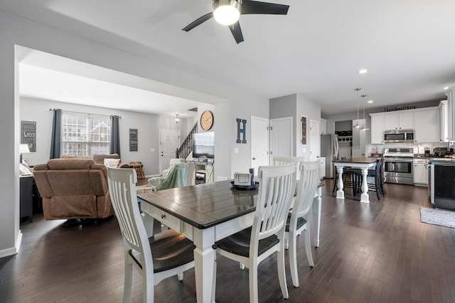 dining space with dark wood-style floors, stairway, a ceiling fan, and recessed lighting