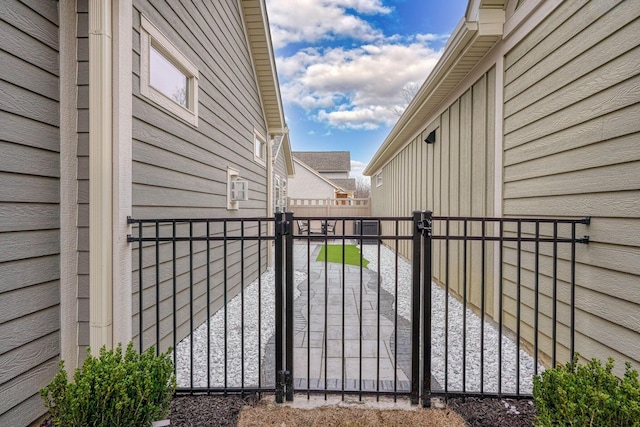 view of gate with fence