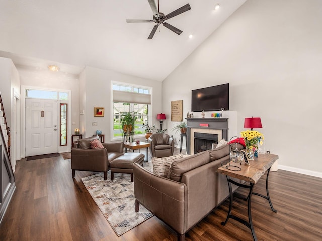 7969 Linksview Cir, Westerville, OH 43082 - living room with high vaulted ceiling, dark wood-style flooring, a fireplace, a ceiling fan, and recessed lighting