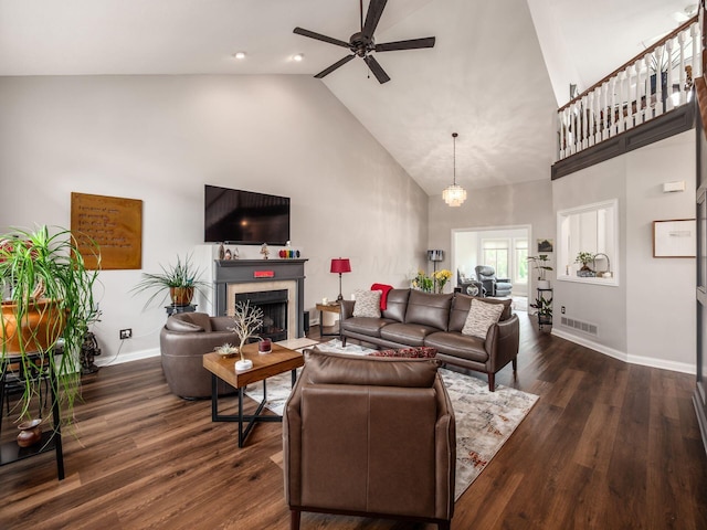 7969 Linksview Cir, Westerville, OH 43082 - living area with high vaulted ceiling, ceiling fan, a fireplace, and dark wood-style flooring