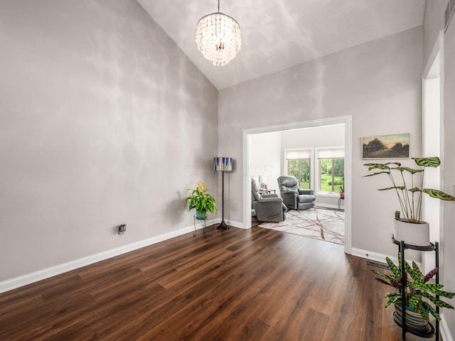 7969 Linksview Cir, Westerville, OH 43082 - unfurnished room with high vaulted ceiling, wood finished floors, and a chandelier