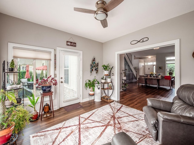 7969 Linksview Cir, Westerville, OH 43082 - living room with ceiling fan, wood finished floors, and stairway