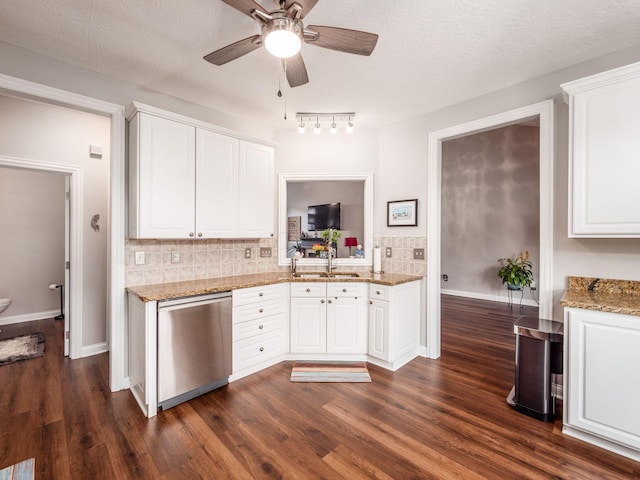 7969 Linksview Cir, Westerville, OH 43082 - kitchen featuring stainless steel dishwasher, ceiling fan, dark wood-type flooring, decorative backsplash, and a textured ceiling