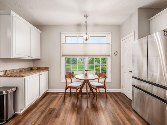 7969 Linksview Cir, Westerville, OH 43082 - dining room with dark wood finished floors and a textured ceiling