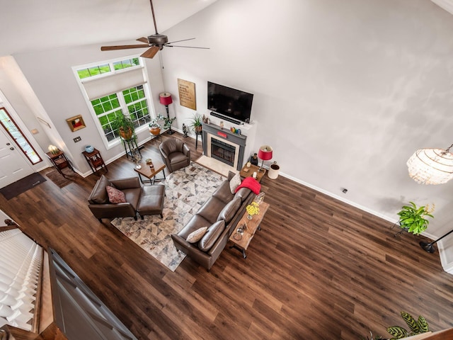 7969 Linksview Cir, Westerville, OH 43082 - living room with wood finished floors, a ceiling fan, high vaulted ceiling, and a fireplace with flush hearth