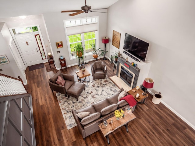 7969 Linksview Cir, Westerville, OH 43082 - living room with wood finished floors, ceiling fan, and a glass covered fireplace