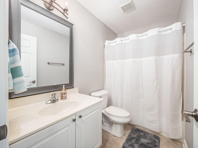 7969 Linksview Cir, Westerville, OH 43082 - bathroom featuring vanity, tile patterned flooring, a textured ceiling, and a shower with shower curtain