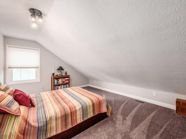 7969 Linksview Cir, Westerville, OH 43082 - carpeted bedroom with vaulted ceiling and a textured ceiling