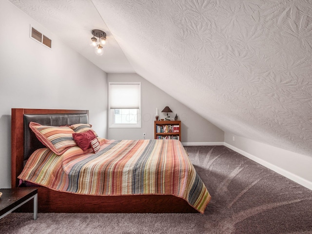 7969 Linksview Cir, Westerville, OH 43082 - bedroom featuring vaulted ceiling, carpet floors, and a textured ceiling