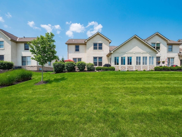 7969 Linksview Cir, Westerville, OH 43082 - back of property with stucco siding, a lawn, and stone siding