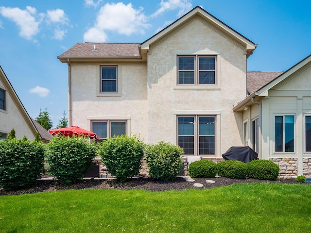 7969 Linksview Cir, Westerville, OH 43082 - rear view of property with stucco siding, a lawn, and a shingled roof