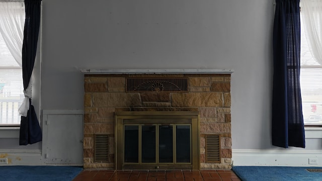 details featuring visible vents and a fireplace