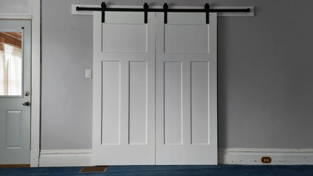 interior details featuring a barn door