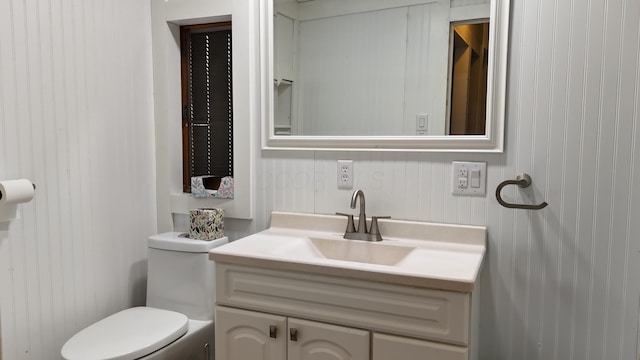 half bath with toilet and vanity