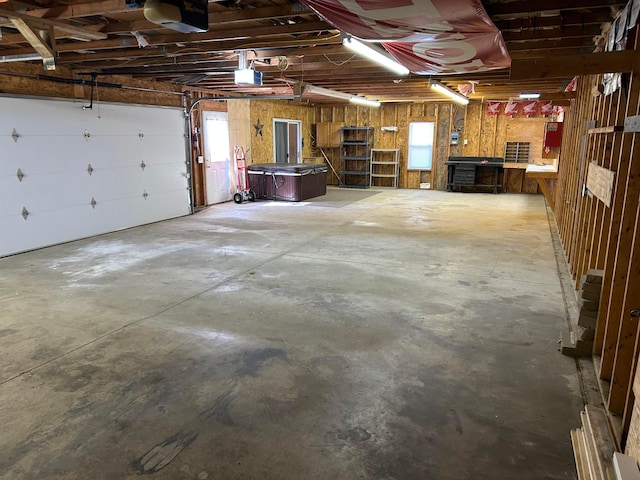 garage featuring a workshop area and a garage door opener