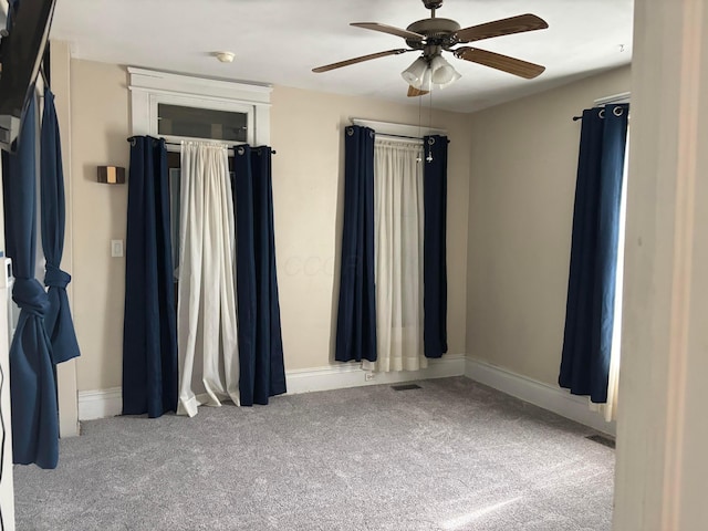 324 E Main St, Cardington, OH 43315 - empty room featuring carpet and ceiling fan