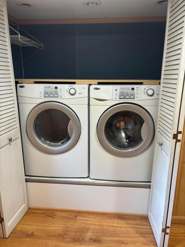 324 E Main St, Cardington, OH 43315 - laundry area featuring washing machine and dryer and light wood-style floors