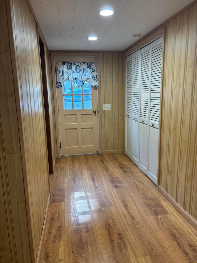 324 E Main St, Cardington, OH 43315 - doorway to outside with wood finished floors, wooden walls, and recessed lighting