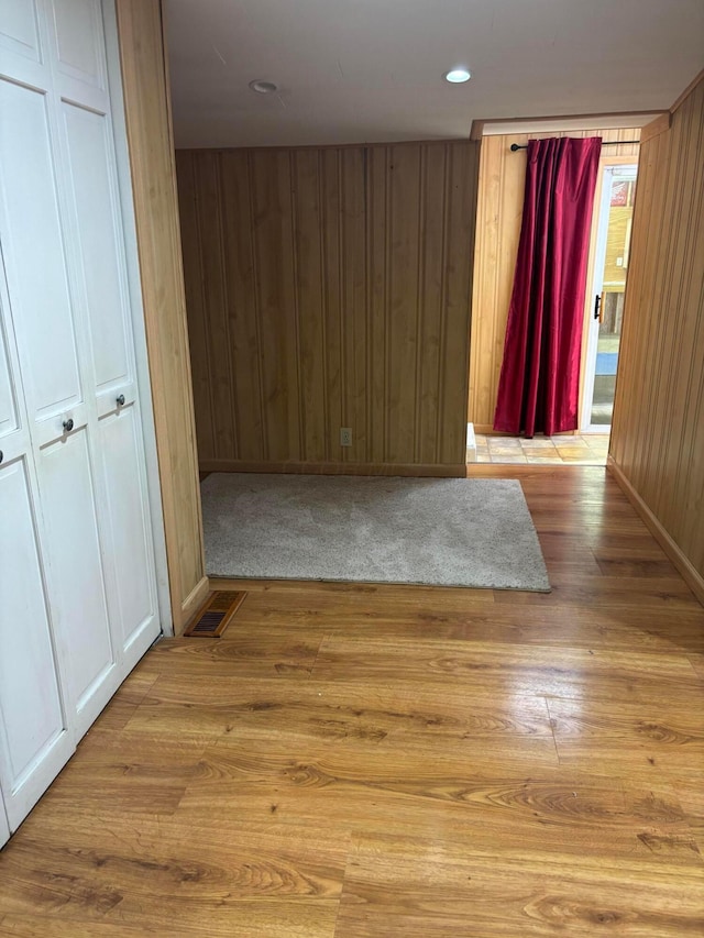 324 E Main St, Cardington, OH 43315 - unfurnished room featuring wood finished floors, wooden walls, and recessed lighting