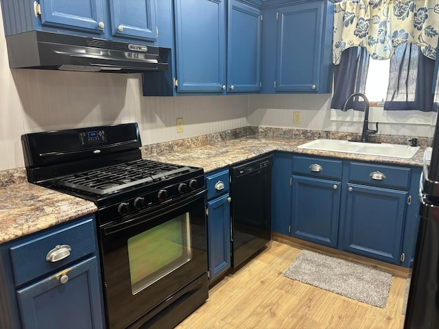 324 E Main St, Cardington, OH 43315 - kitchen featuring blue cabinetry, black appliances, under cabinet range hood, and light wood-style flooring