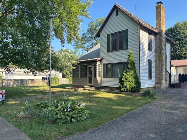 324 E Main St, Cardington, OH 43315 - view of front of property with a chimney, a sunroom, and entry steps