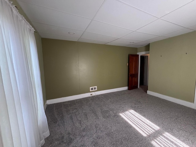 324 E Main St, Cardington, OH 43315 - empty room with carpet floors and a paneled ceiling