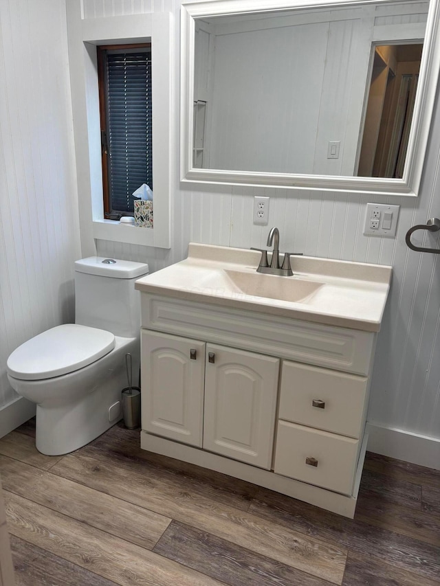 324 E Main St, Cardington, OH 43315 - bathroom with vanity, wood finished floors, and wooden walls