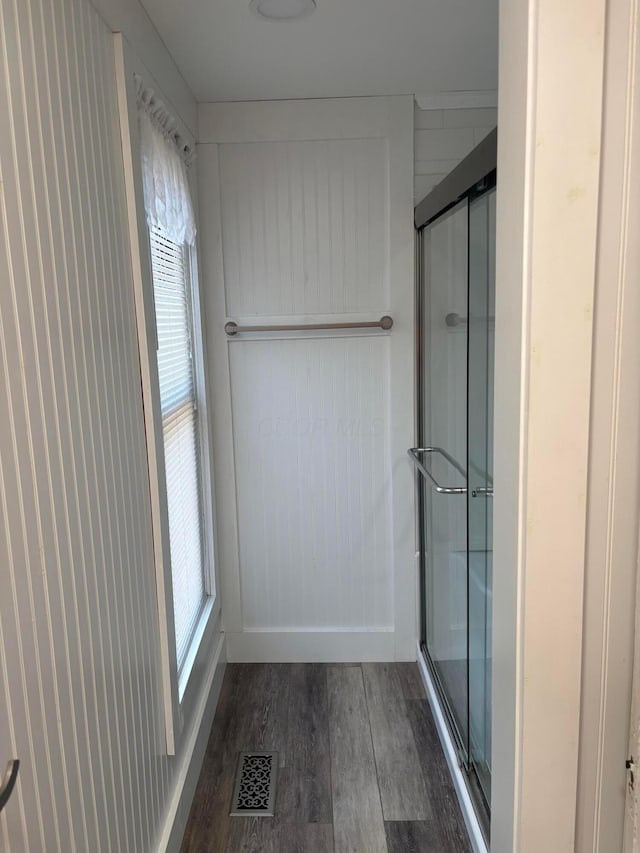324 E Main St, Cardington, OH 43315 - bathroom featuring wood finished floors, plenty of natural light, and an enclosed shower
