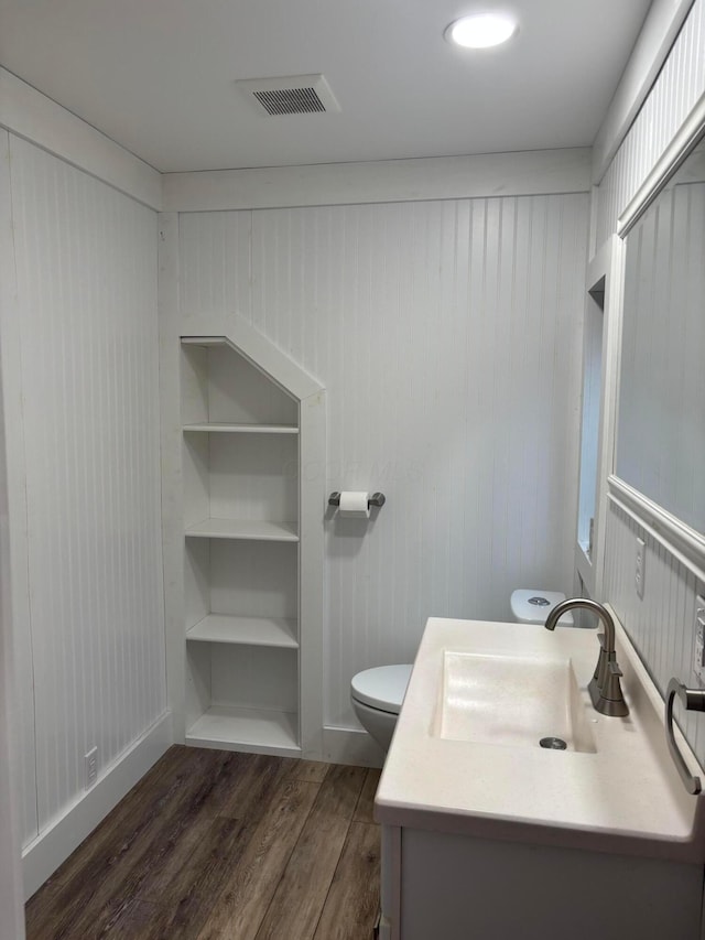 324 E Main St, Cardington, OH 43315 - bathroom featuring wood finished floors and vanity