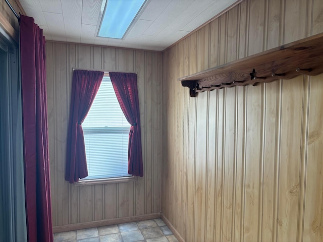324 E Main St, Cardington, OH 43315 - empty room with plenty of natural light and wooden walls