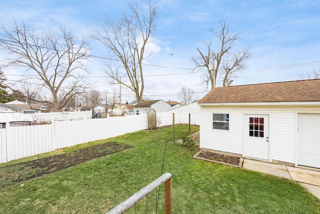 view of yard with fence and an outdoor structure