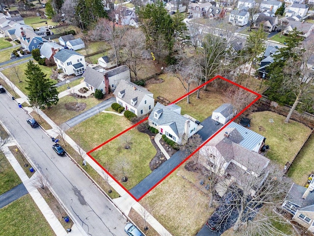 birds eye view of property with a residential view