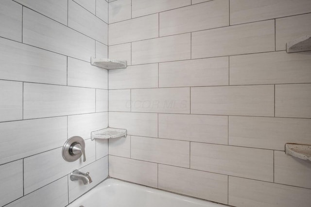 interior details featuring  shower combination