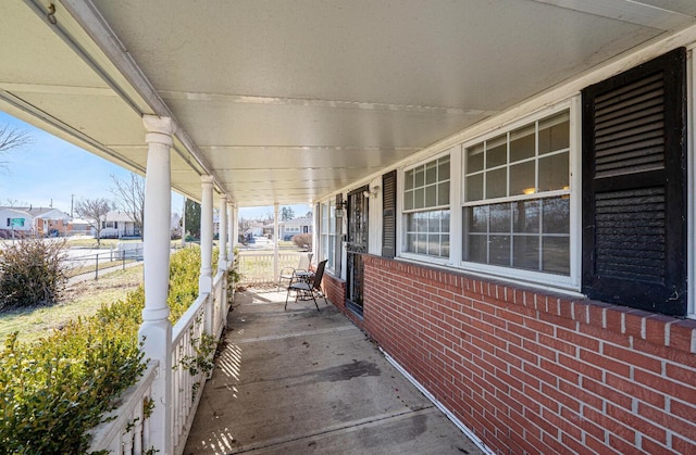 view of patio / terrace featuring covered porch and a residential view