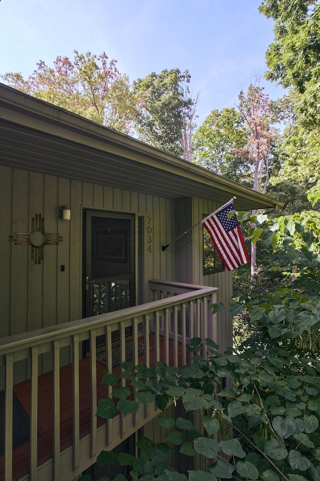 view of exterior entry featuring board and batten siding