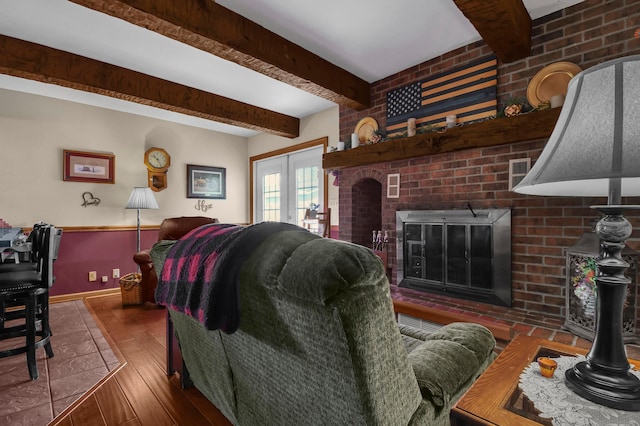 1846 River Rd, Bucyrus, OH 44820 - living area featuring hardwood / wood-style floors, beamed ceiling, a fireplace, and baseboards