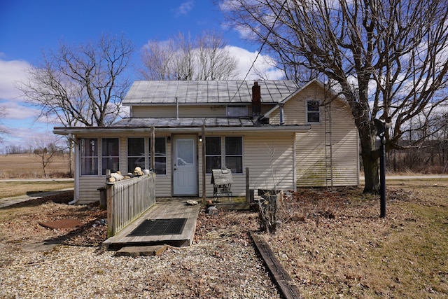 2930 County Road 184, Cardington, OH 43315 - view of front of house featuring a chimney and a sunroom