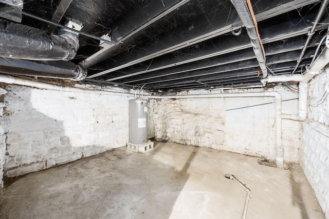 unfinished basement with electric water heater