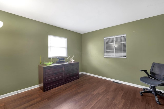 home office featuring dark wood-type flooring and baseboards