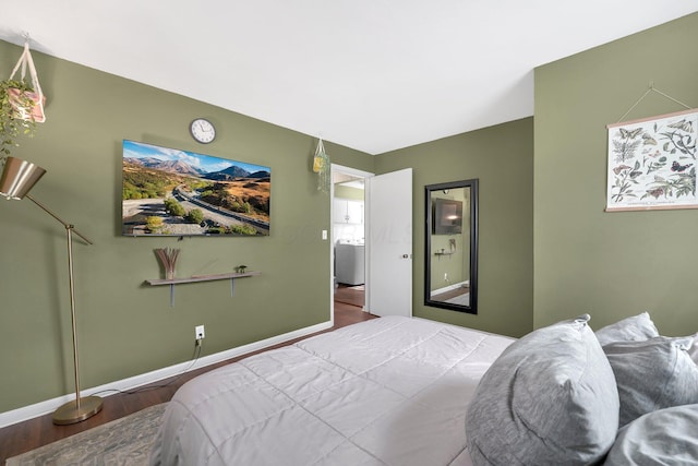 bedroom featuring wood finished floors and baseboards