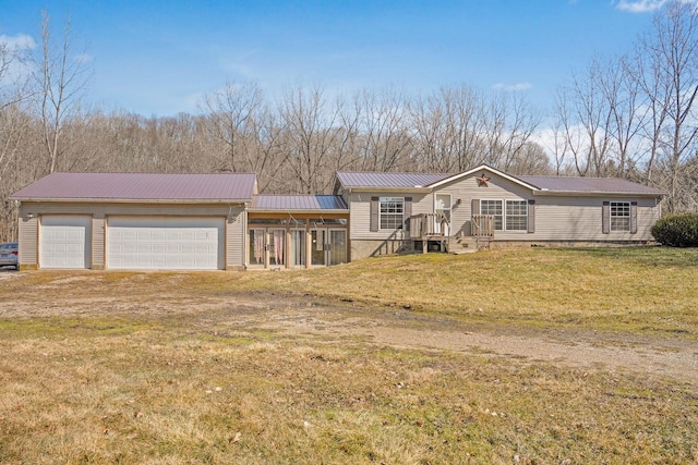 view of front of house with a front yard and metal roof