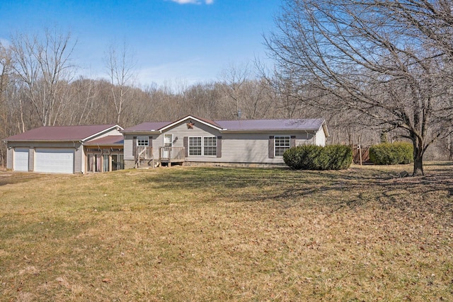 view of front of property featuring a garage and a front yard