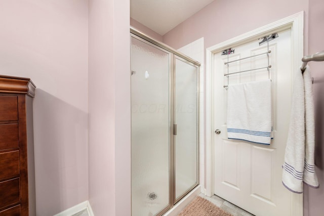 bathroom with a shower stall