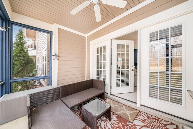 sunroom featuring wooden ceiling and ceiling fan