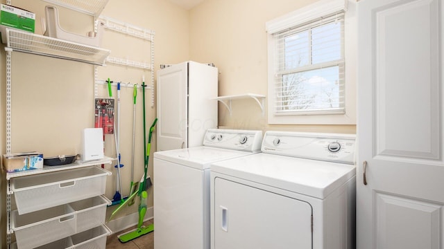 clothes washing area featuring laundry area and independent washer and dryer