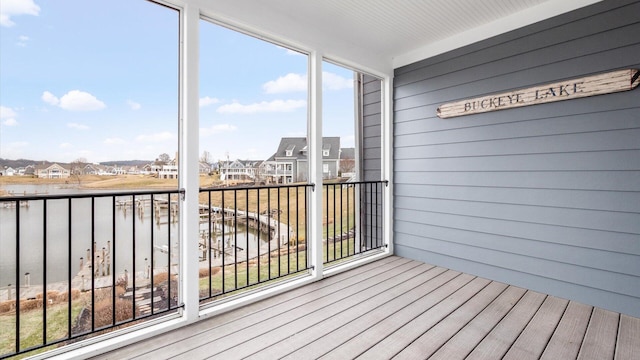 unfurnished sunroom with a residential view