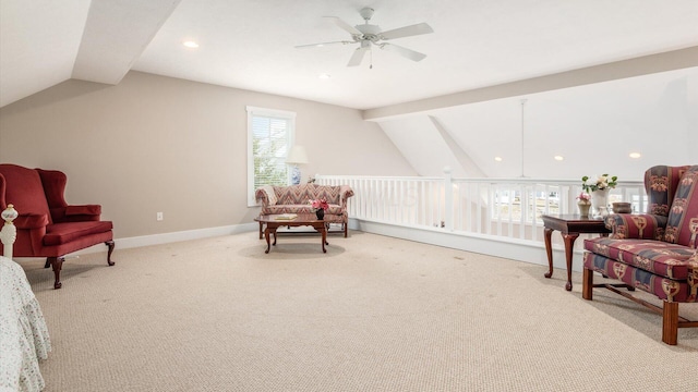 sitting room with vaulted ceiling with beams, a ceiling fan, baseboards, and carpet flooring