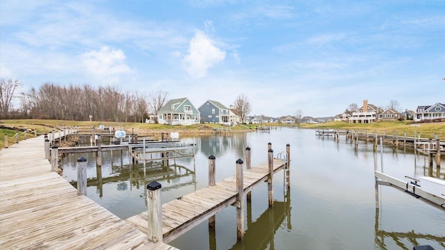 dock area with a water view and a residential view